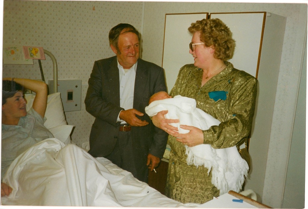 Photograph of my Granny and Granddad visiting me on the day I was born